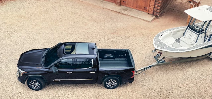 A black 2026 Toyota Tundra in towing action.