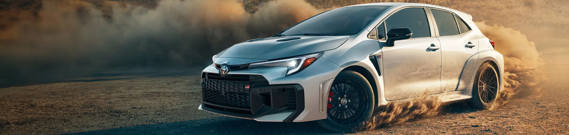 2026 Toyota GR Corolla turning and kicking up dirt